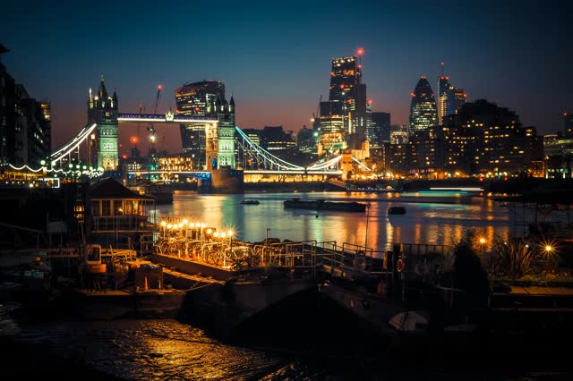 Tower Bridge lit up at night over the Thames